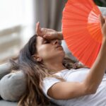 Exhausted Young Woman Lying Couch Living Room Using Hand Fan Feeling Sick Home Tired Millennial Girl Waving With Hand Waver Suffer From Heatstroke Lack Fresh Air No Air Conditioner
